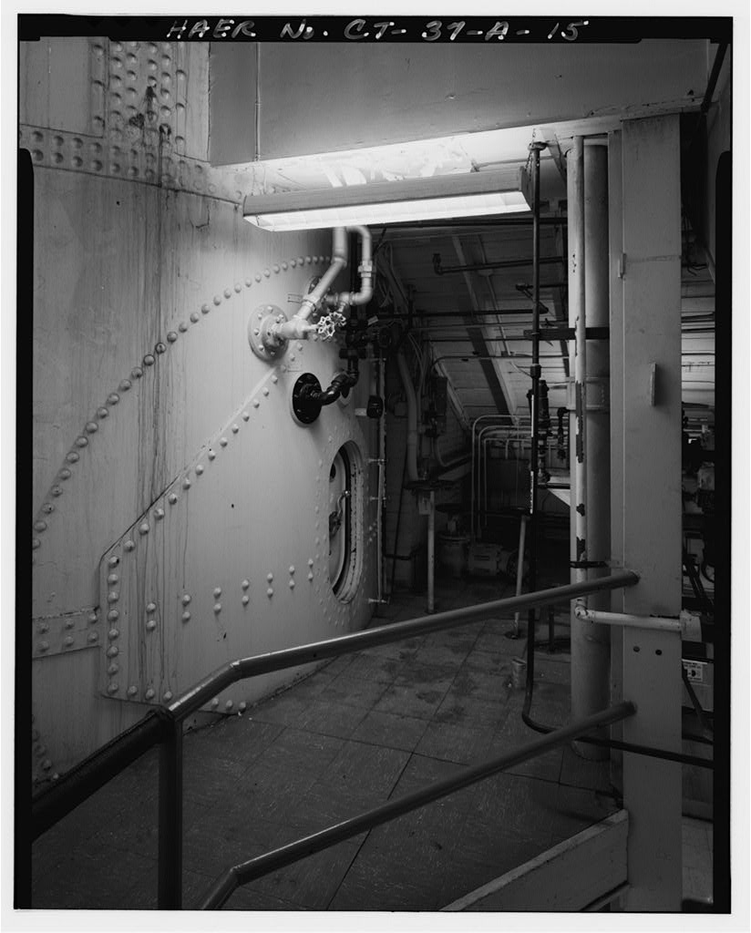 View of escape training tank, looking east across mezzanine, showing entrance to submarine section at 110-foot level