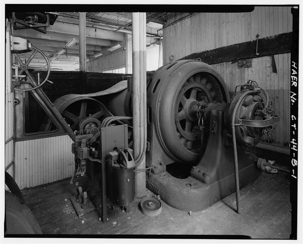 View east of generator; belt-tightening mechanism at left