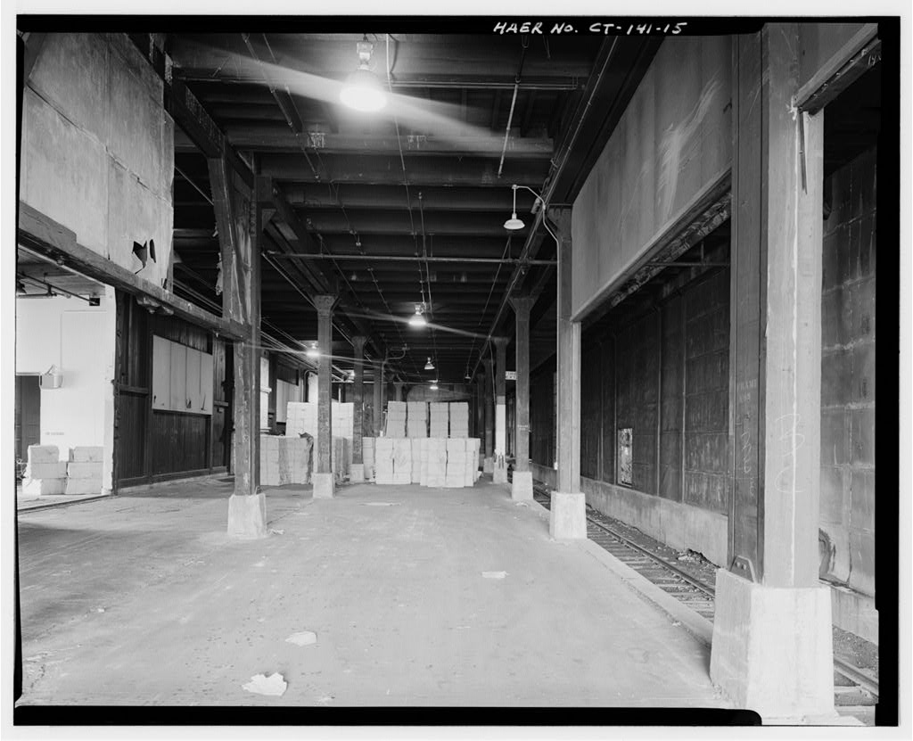 Interior, showing lower level of main warehouse, rails on right
