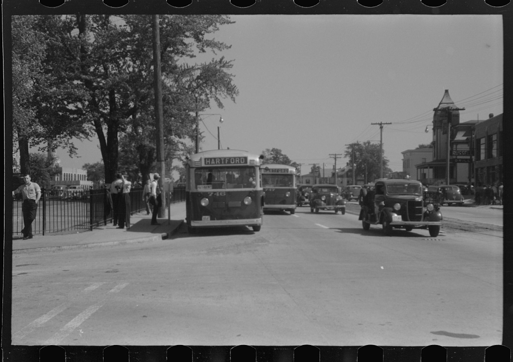 Buses outside the aircraft plant (attribution tentative in catalog)