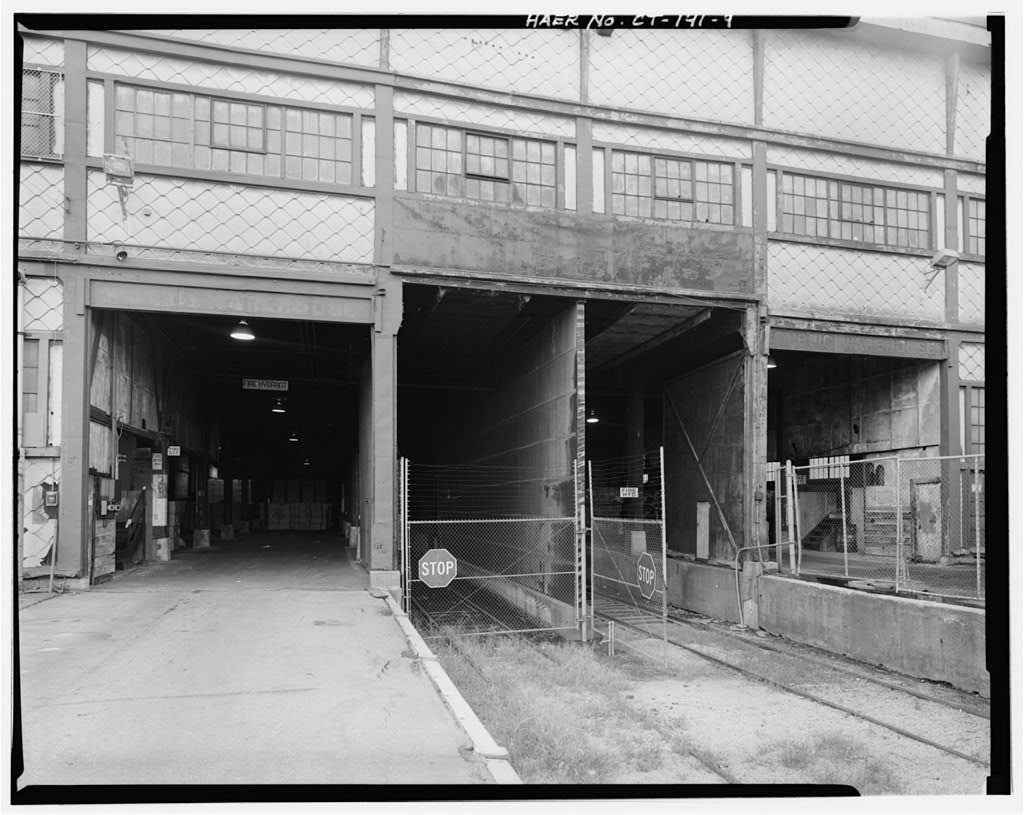 View south, detail of north end of main warehouse, showing truck and rail entrances