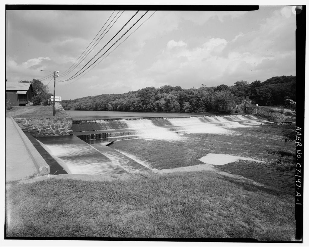 View northeast, general view of dam, with canal spillway and gatehouse visible on left