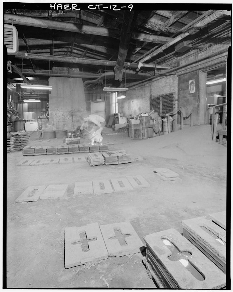 GENERAL VIEW OF MOLTEN BRASS BEING POURED INTO BELL MOLDS - Bevin Brothers Bell Shops, Bevin Court, East Hampton,…